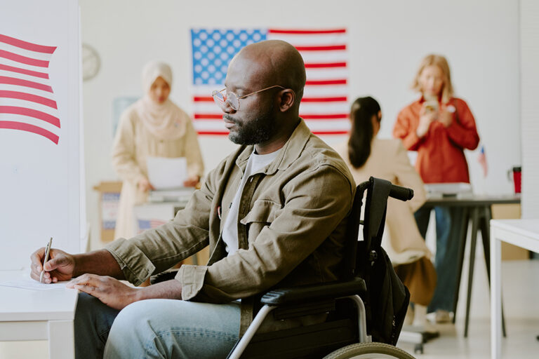 Veteran With Disability Filling In Paperwork